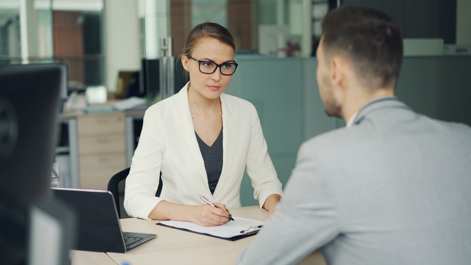 An HR meeting between two employees in an office